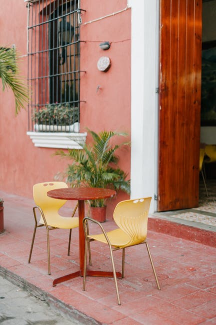 Restaurant Location with outdoor table and two chairs